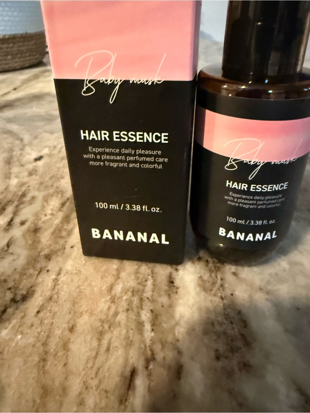 Bananal Hair Essence Bottle with Pink and Black Packaging for hair growth
